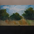Small painting of a field with trees